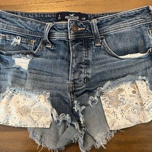 Hollister Blue Distressed Denim Cutoff Shorts with White Patterned Patches